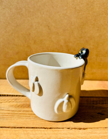 Mug with small white pumpkins