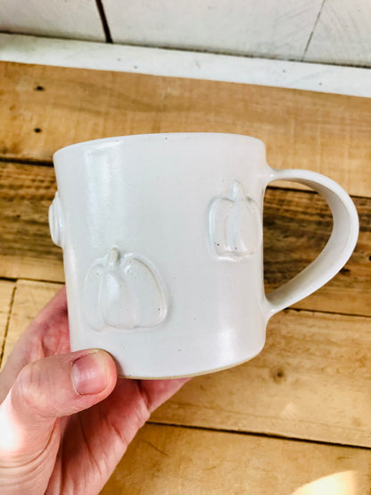 Mug with small white pumpkins