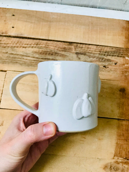 Mug with small white pumpkins