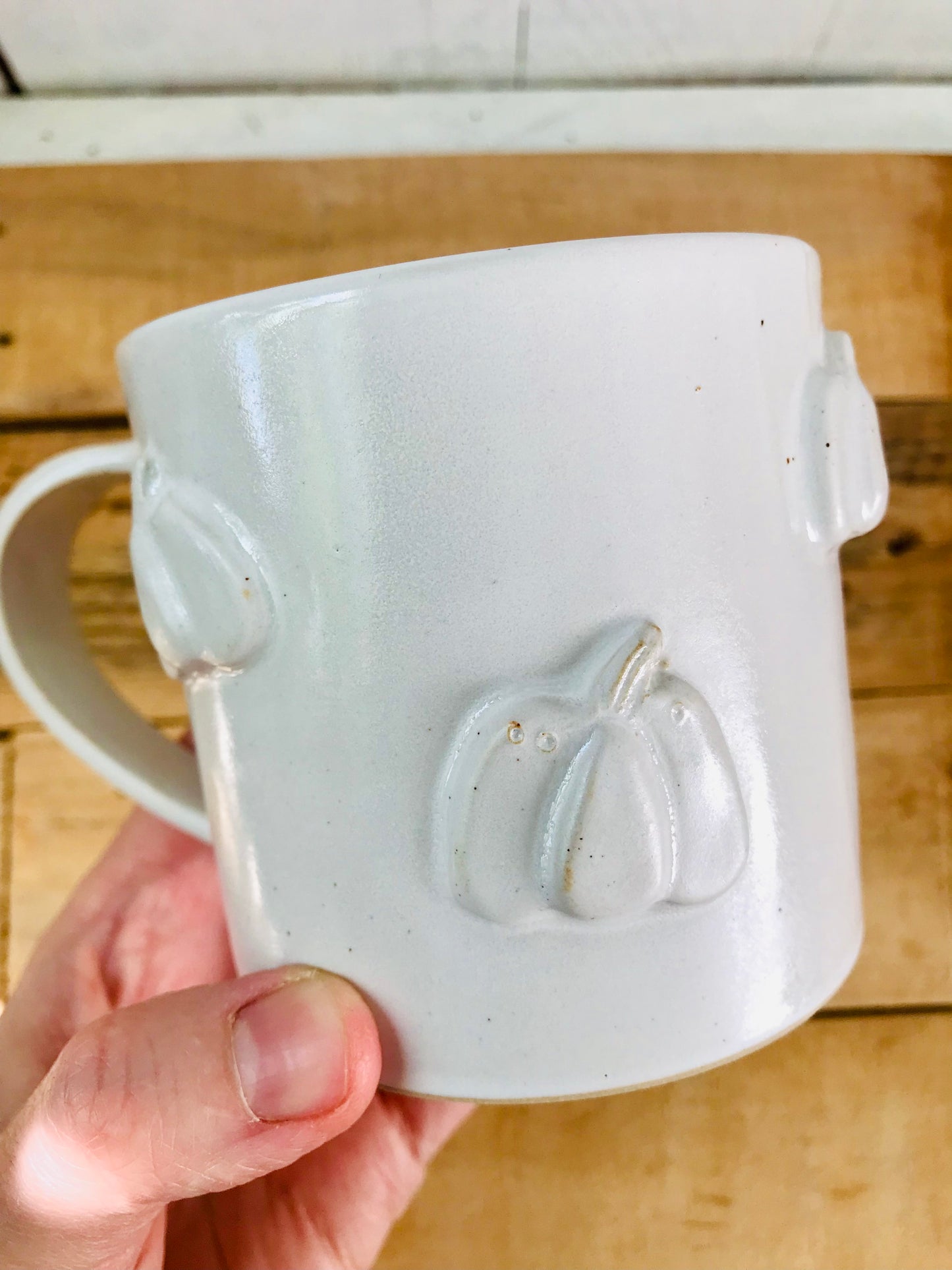 Mug with small white pumpkins