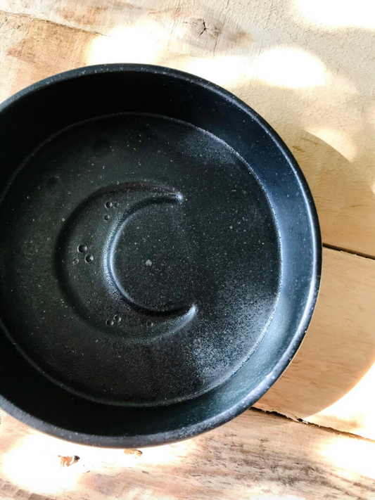 Pet bowl with black moon pattern