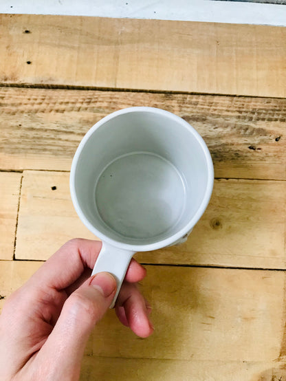 Mug with small white pumpkins